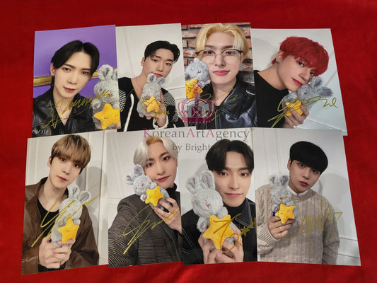 ATEEZ 8-piece autograph set featuring signatures from Wooyoung, Hong Joong, and others